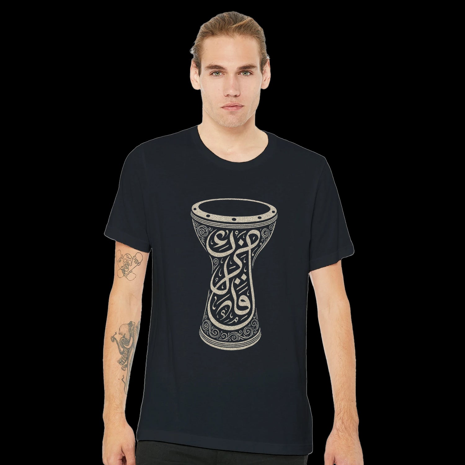 Black calligraphy style cotton shirt from the Soul of the Darbuka collection perfect for fans of Islamic art modern fashion and identity-driven design. DTG optimized for crisp printing this eco-conscious unisex t-shirt offers style comfort and cultural depth in one powerful look.