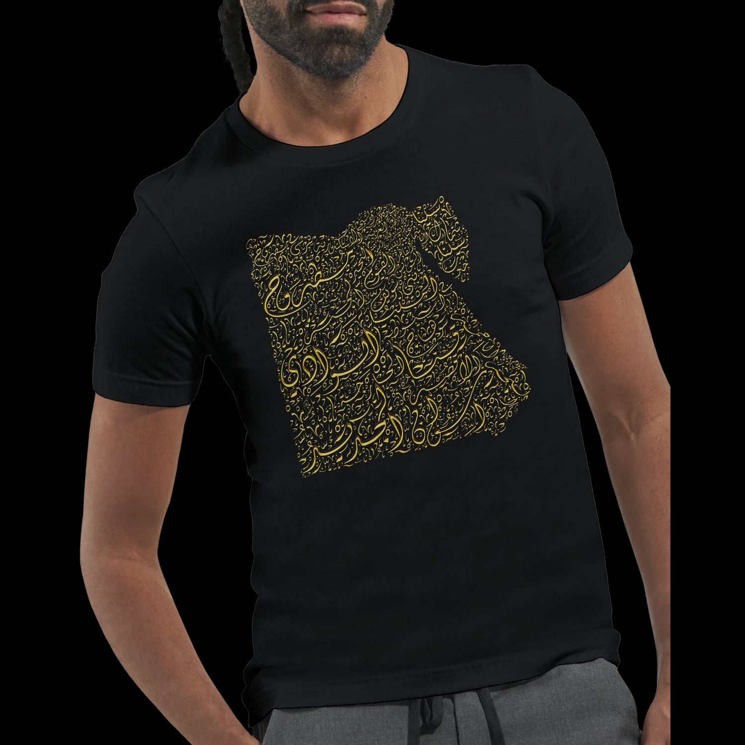 Man wearing black cotton t-shirt with gold Egypt calligraphy map.