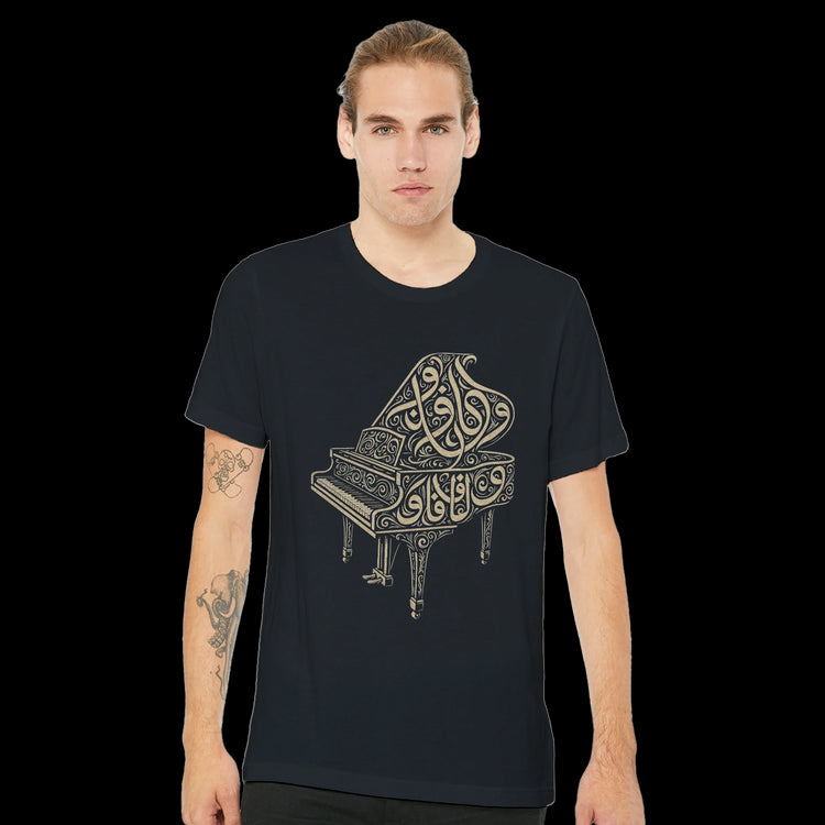 Black Arabic calligraphy t-shirt with piano-inspired artwork. Premium cotton shirt for men and women who appreciate modern Islamic art, identity fashion, and artistic streetwear.